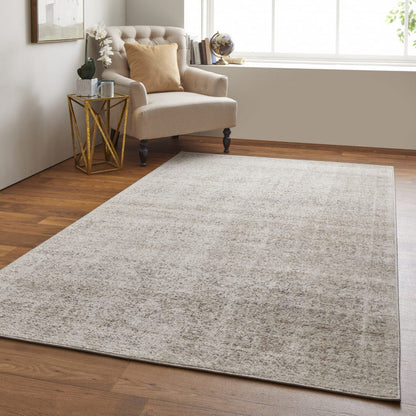 4' X 6' Ivory Tan And Gray Abstract Power Loom Distressed Area Rug