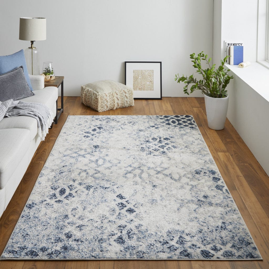 4' X 6' Ivory And Blue Abstract Power Loom Distressed Area Rug