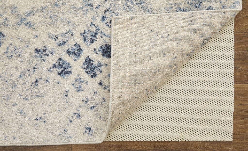 4' X 6' Ivory And Blue Abstract Power Loom Distressed Area Rug