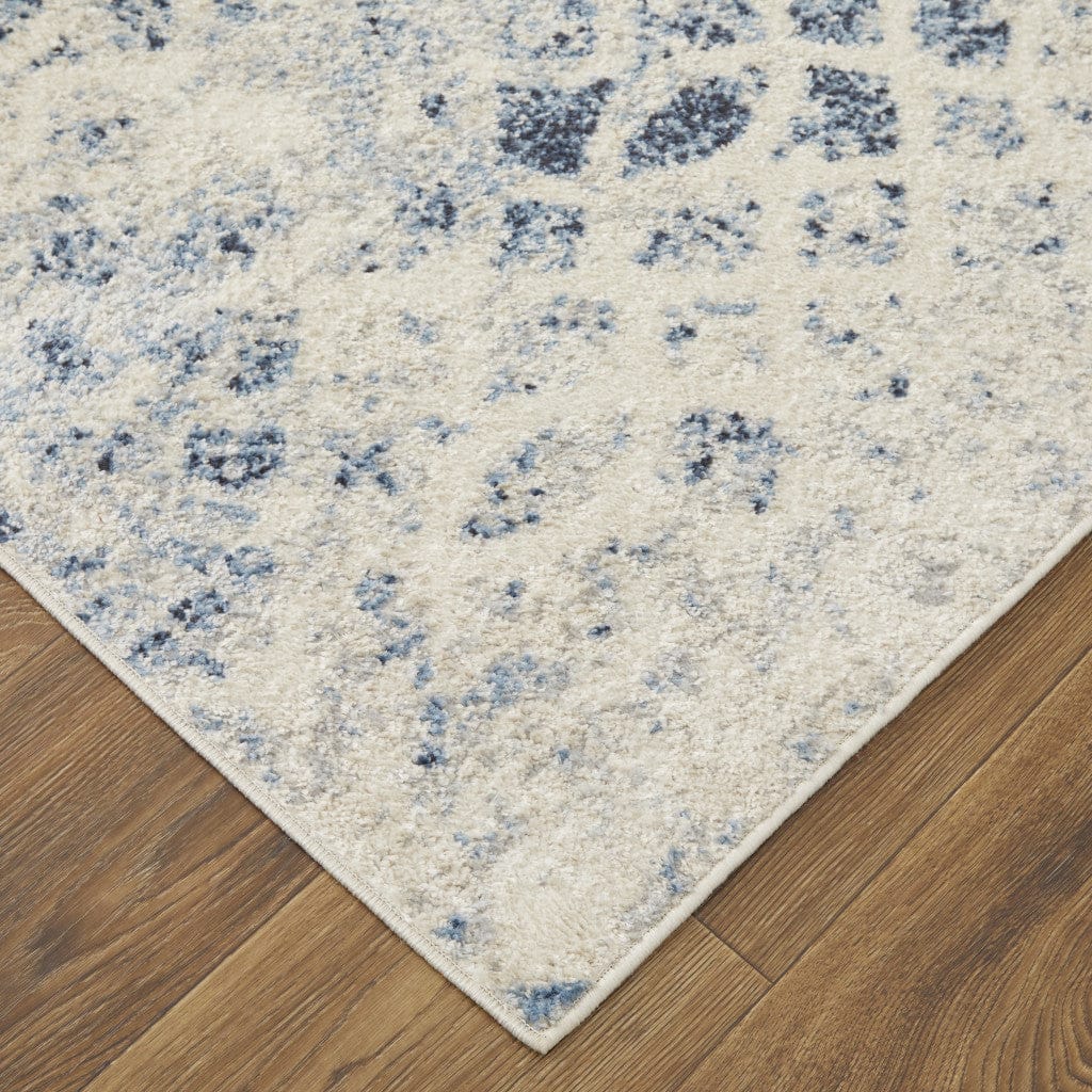 4' X 6' Ivory And Blue Abstract Power Loom Distressed Area Rug
