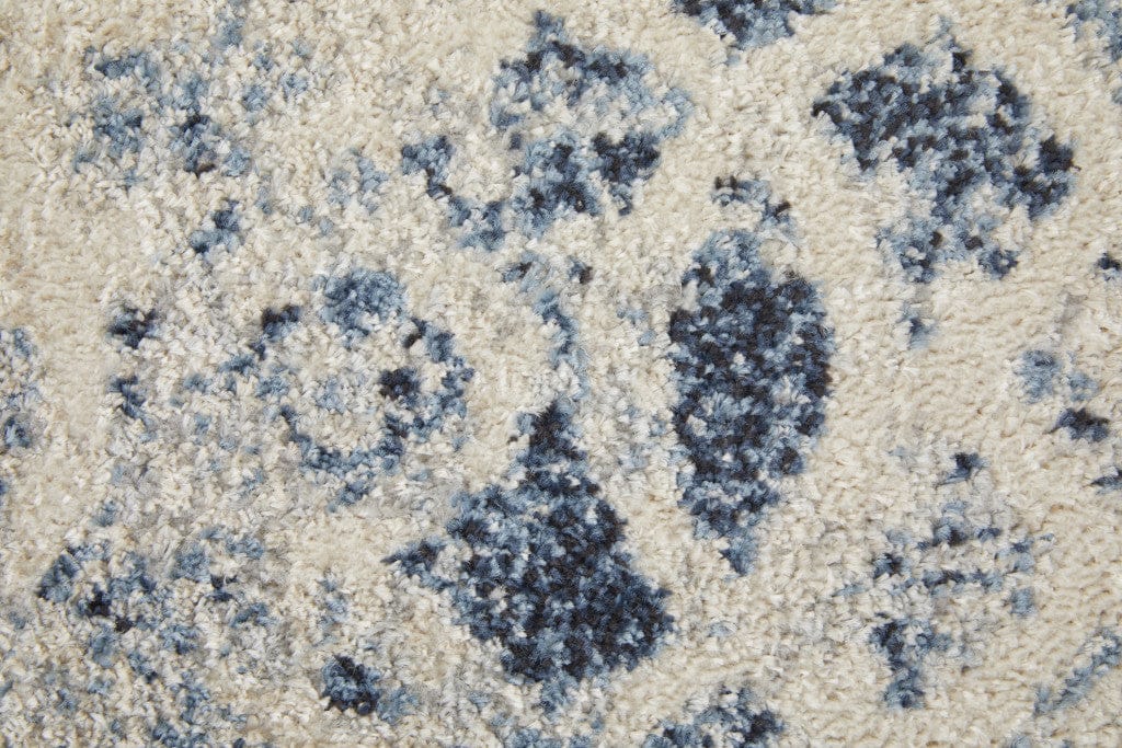 4' X 6' Ivory And Blue Abstract Power Loom Distressed Area Rug