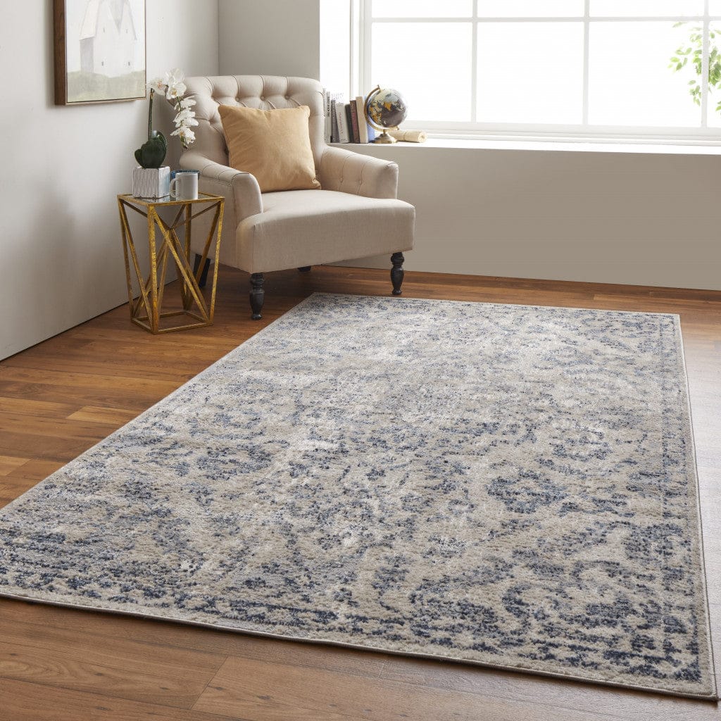 4' X 6' Blue Gray And Ivory Floral Power Loom Distressed Area Rug