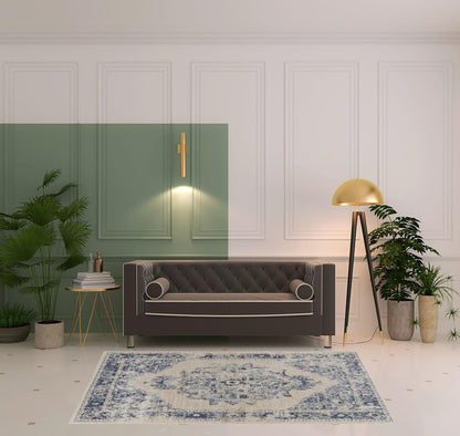 5' X 8' Ivory And Blue Floral Power Loom Distressed Area Rug