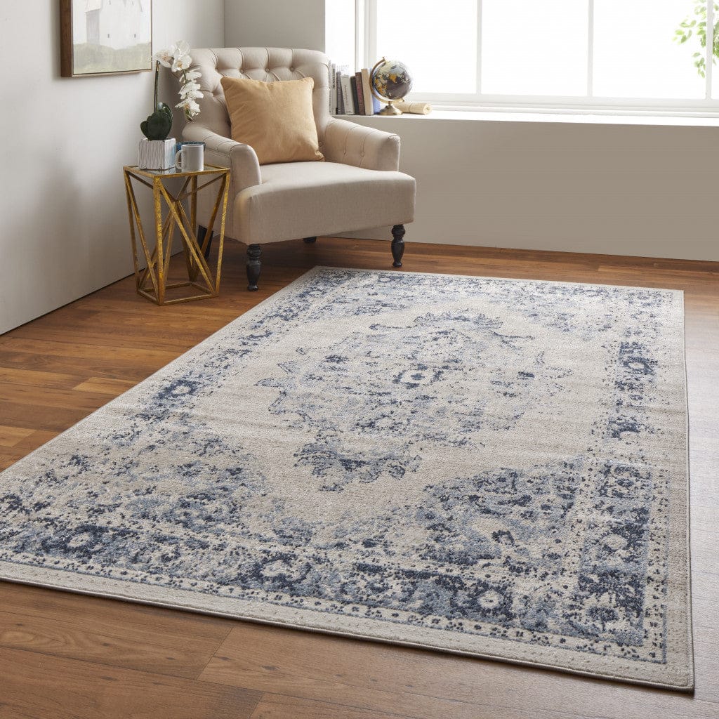5' X 8' Ivory And Blue Floral Power Loom Distressed Area Rug