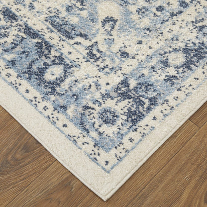 5' X 8' Ivory And Blue Floral Power Loom Distressed Area Rug