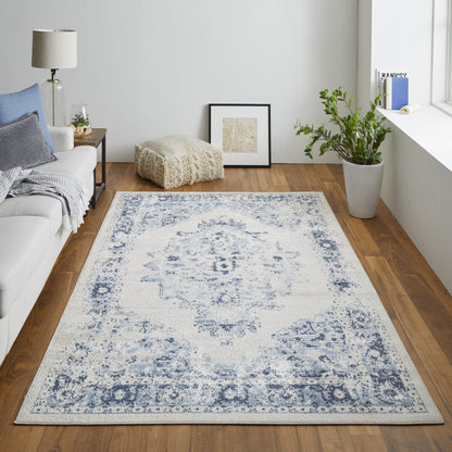 5' X 8' Ivory And Blue Floral Power Loom Distressed Area Rug