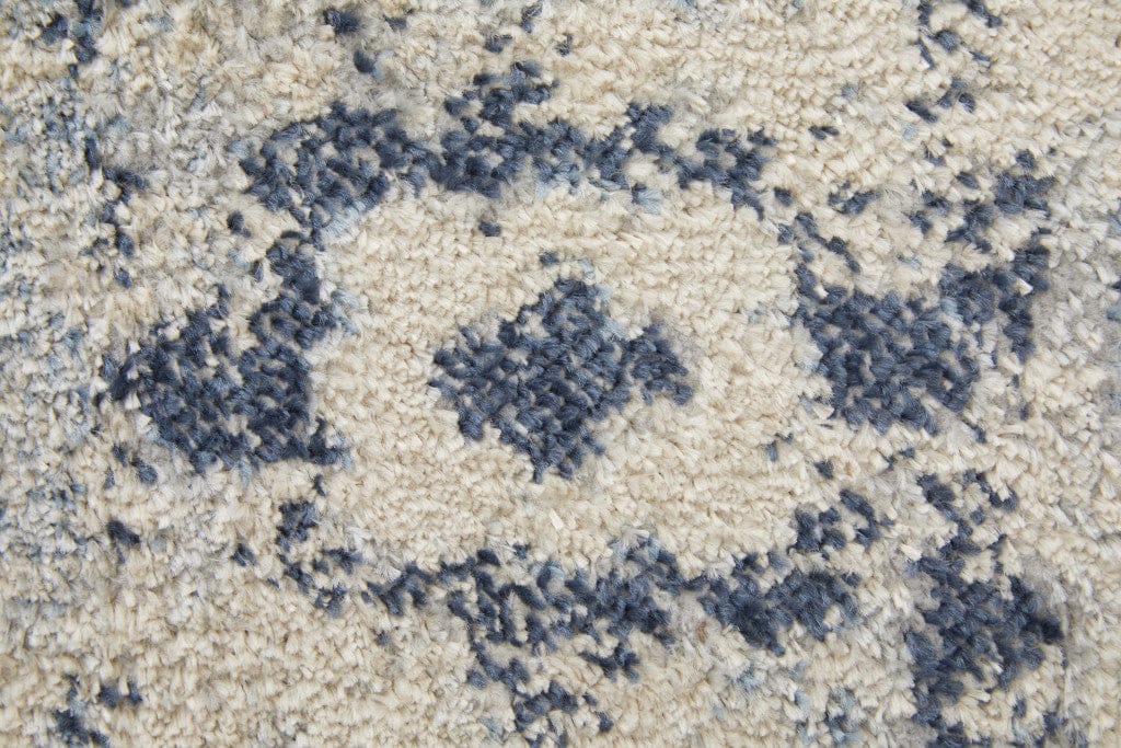 5' X 8' Ivory And Blue Floral Power Loom Distressed Area Rug