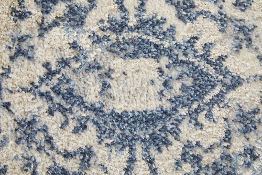 4' X 6' Blue And Ivory Floral Power Loom Distressed Area Rug