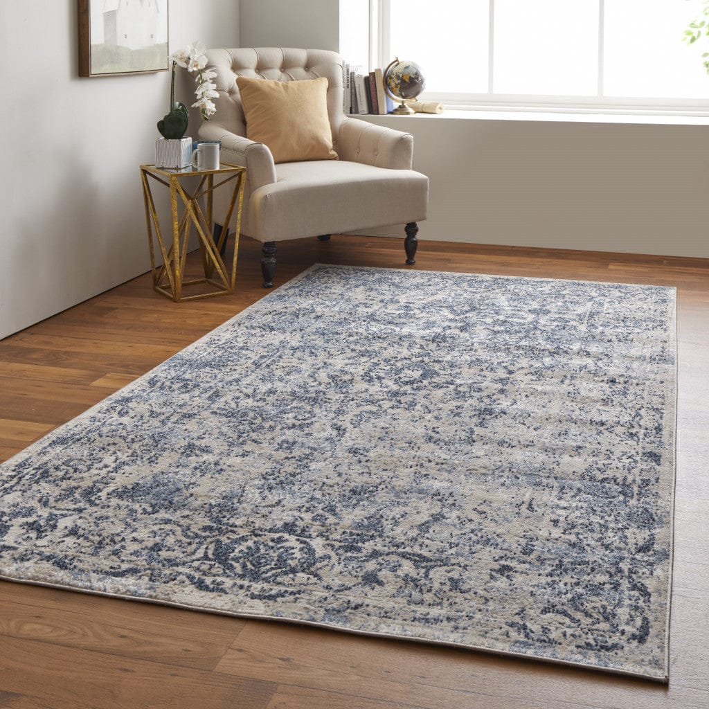 4' X 6' Blue And Ivory Floral Power Loom Distressed Area Rug