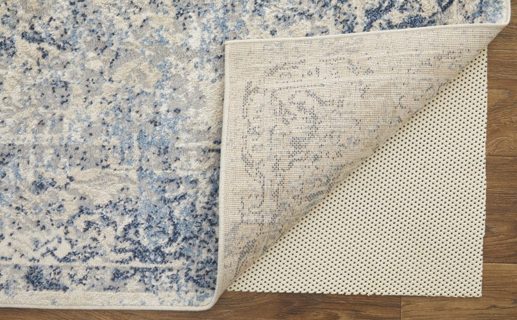 4' X 6' Blue And Ivory Floral Power Loom Distressed Area Rug