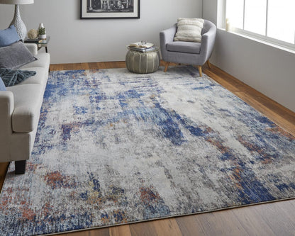 3' X 5' Ivory And Blue Abstract Power Loom Distressed Stain Resistant Area Rug