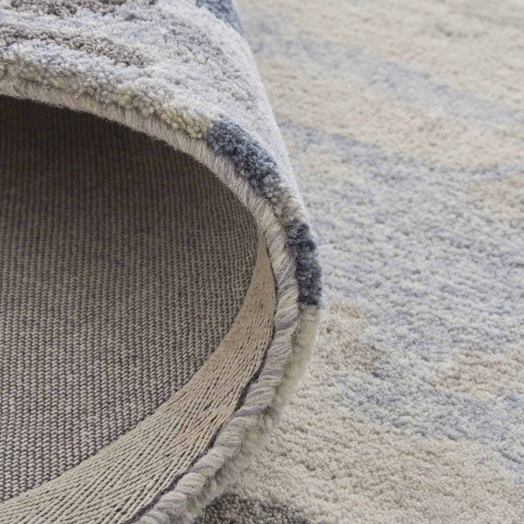 4' X 6' Blue Gray And Ivory Wool Abstract Tufted Handmade Stain Resistant Area Rug