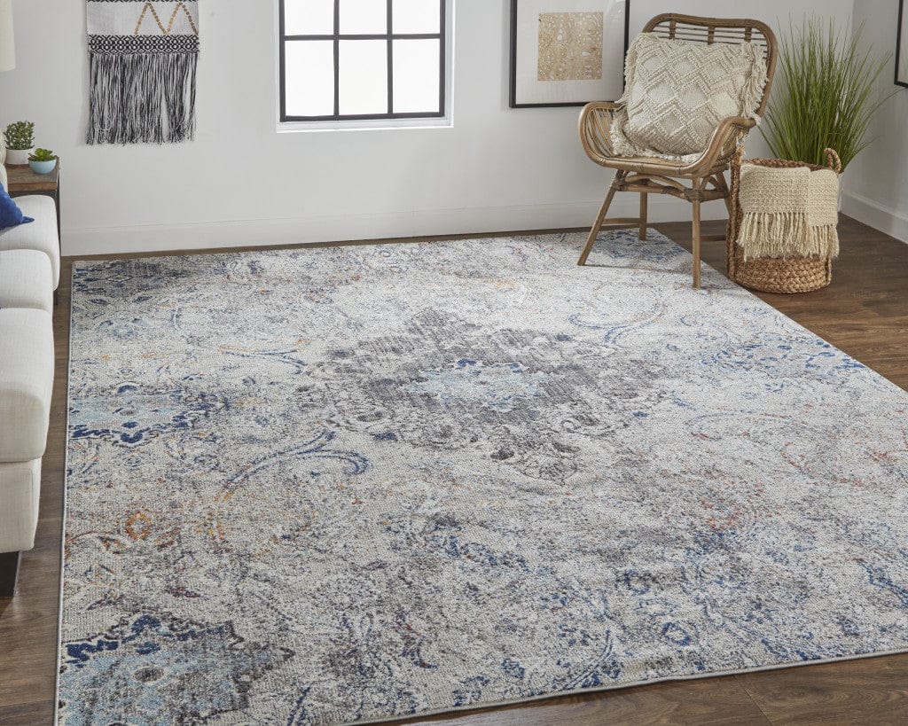 5' X 8' Ivory Taupe And Blue Floral Power Loom Distressed Stain Resistant Area Rug