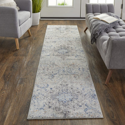 5' X 8' Ivory Taupe And Blue Floral Power Loom Distressed Stain Resistant Area Rug