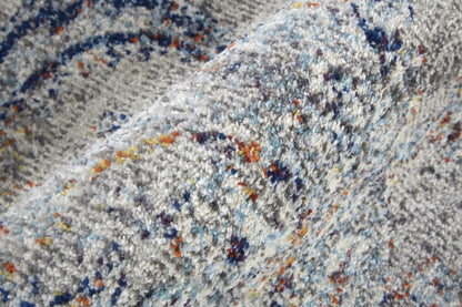 5' X 8' Ivory Taupe And Blue Floral Power Loom Distressed Stain Resistant Area Rug