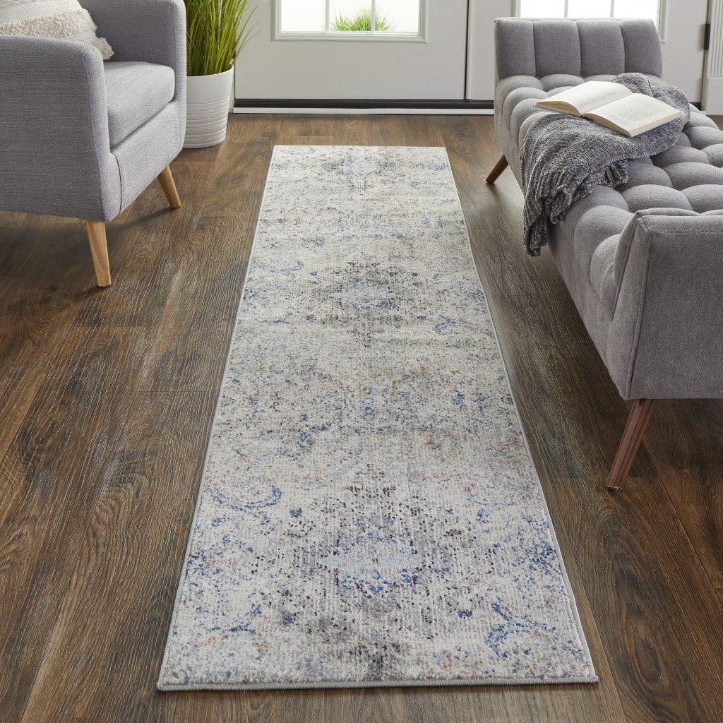 5' X 8' Ivory Taupe And Blue Floral Power Loom Distressed Stain Resistant Area Rug