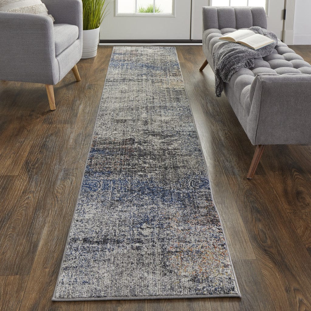 5' X 8' Taupe Blue And Ivory Abstract Power Loom Distressed Stain Resistant Area Rug