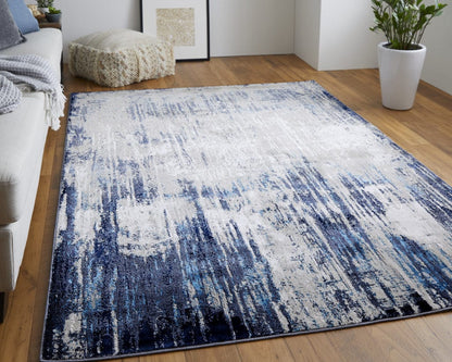 4' X 6' Tan Blue And Ivory Abstract Power Loom Distressed Area Rug