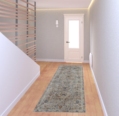 5' X 8' Tan Orange And Red Floral Power Loom Distressed Area Rug With Fringe