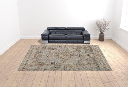 5' X 8' Tan Orange And Red Floral Power Loom Distressed Area Rug With Fringe