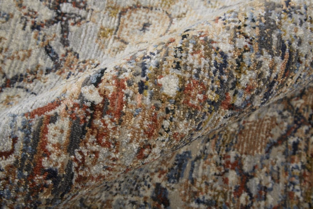 5' X 8' Tan Orange And Blue Floral Power Loom Distressed Area Rug With Fringe