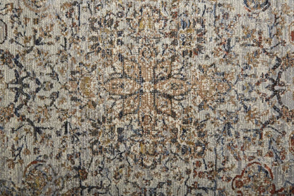 5' X 8' Tan Orange And Blue Floral Power Loom Distressed Area Rug With Fringe