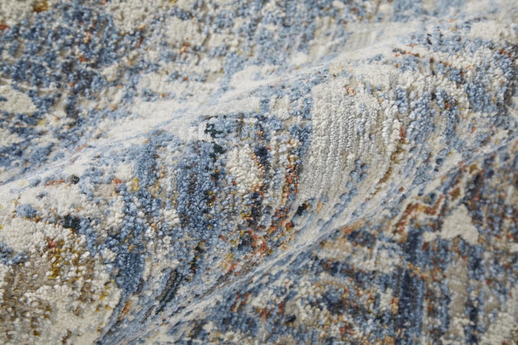 5' X 8' Ivory Orange And Blue Floral Power Loom Distressed Area Rug With Fringe