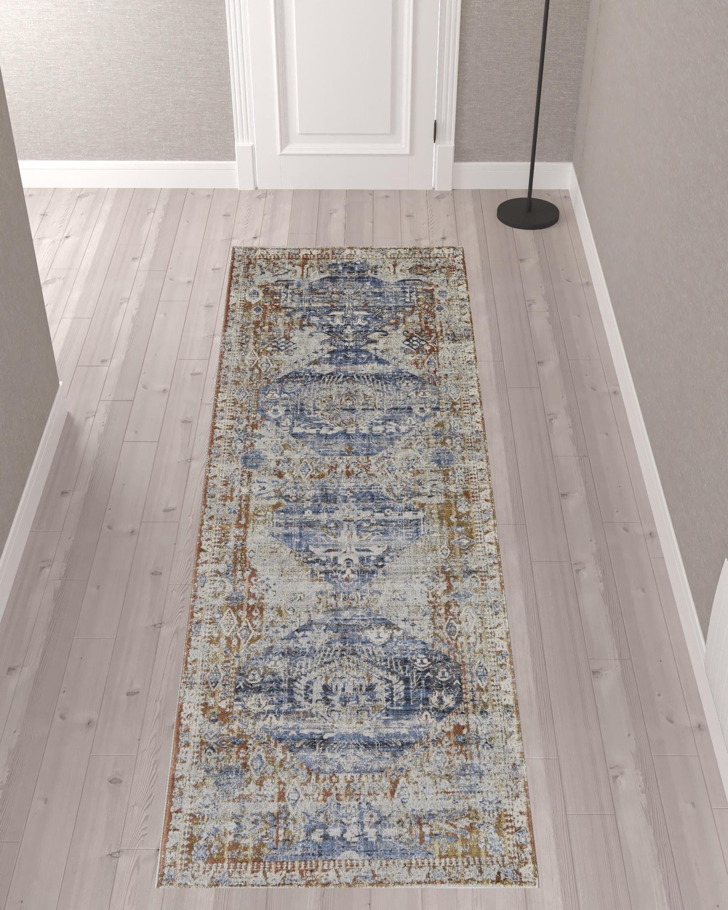 5' X 8' Ivory Orange And Blue Floral Power Loom Distressed Area Rug With Fringe