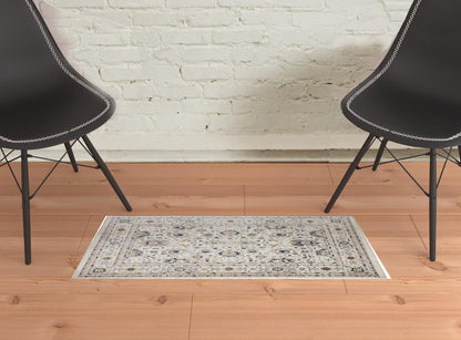 4' X 6' Tan Ivory And Blue Floral Stain Resistant Area Rug