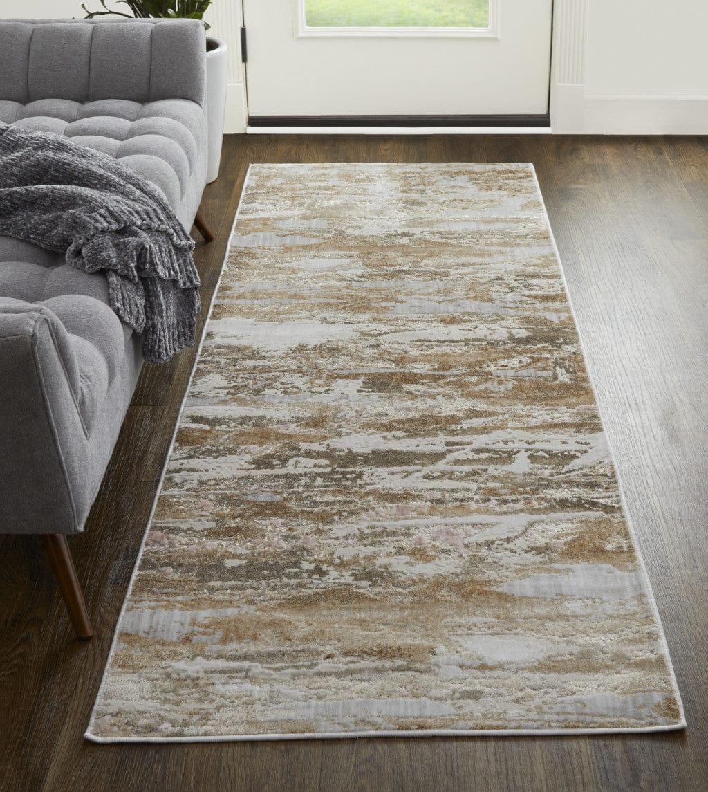 4' X 6' Tan Orange And Ivory Abstract Power Loom Distressed Area Rug