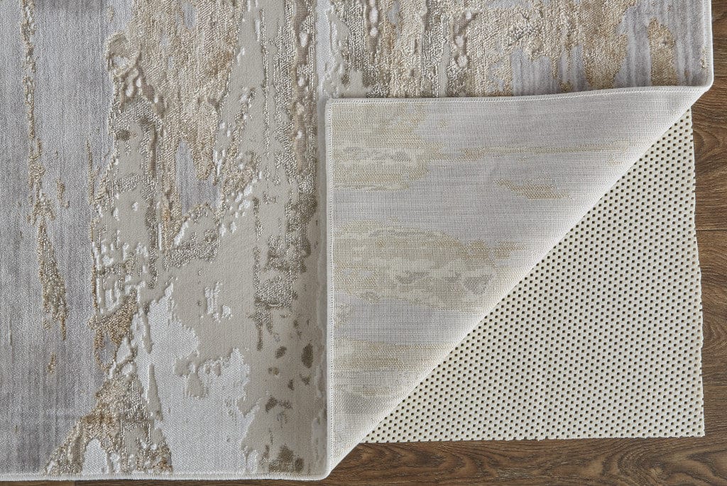 4' X 6' Tan Orange And Ivory Abstract Power Loom Distressed Area Rug