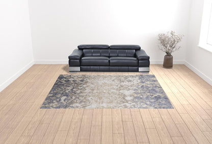 4' X 6' Tan Ivory And Blue Abstract Power Loom Distressed Area Rug