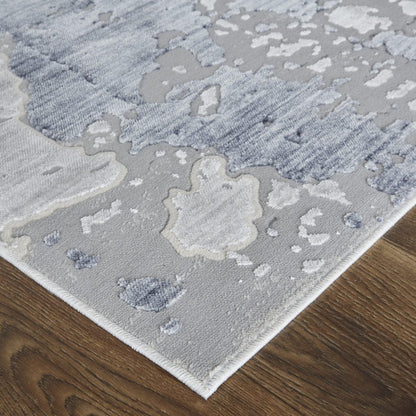 4' X 6' Ivory And Blue Abstract Power Loom Distressed Area Rug