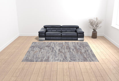 4' X 6' Tan Taupe And Gray Abstract Power Loom Distressed Stain Resistant Area Rug