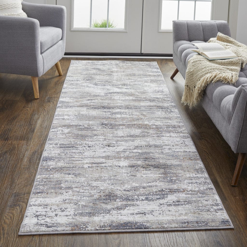 4' X 6' Tan Taupe And Gray Abstract Power Loom Distressed Stain Resistant Area Rug