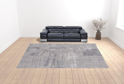 4' X 6' Taupe Tan And Blue Abstract Power Loom Distressed Stain Resistant Area Rug