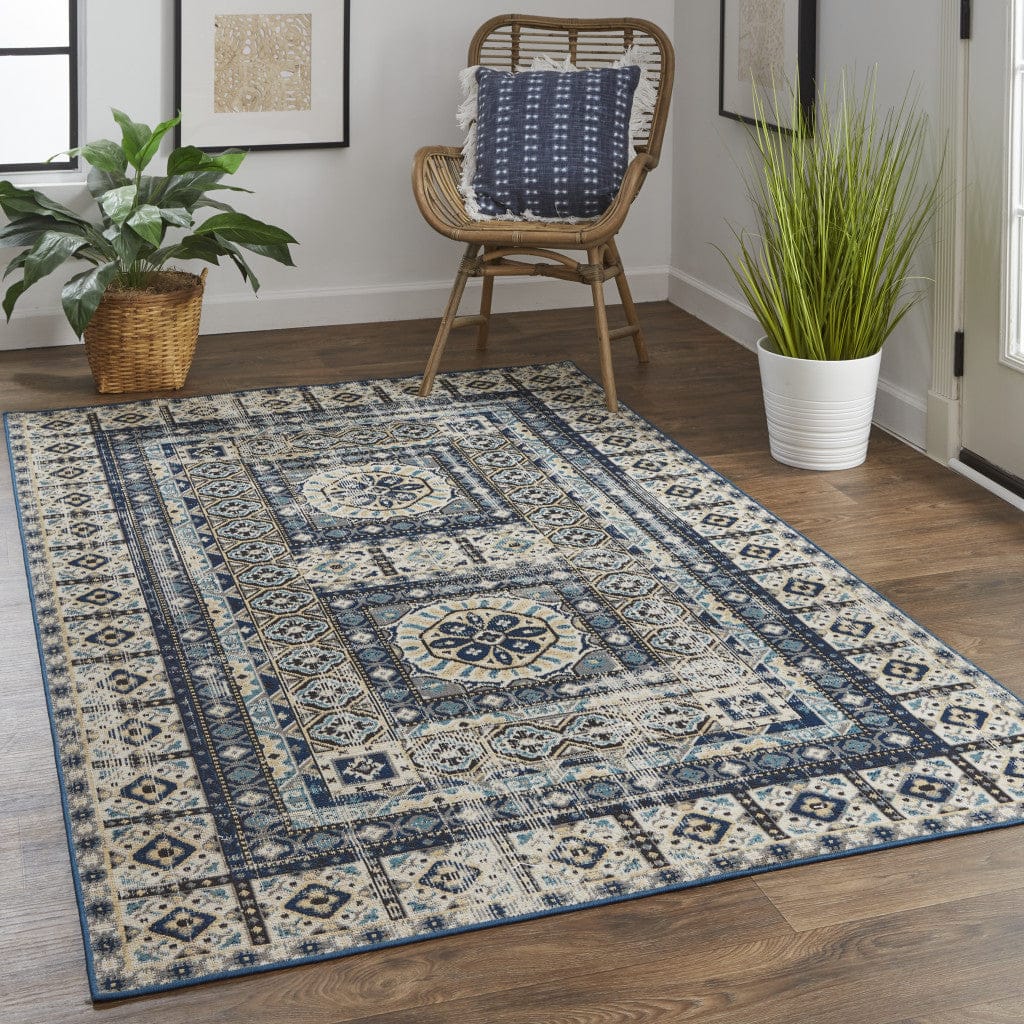 4' X 6' Ivory Tan And Blue Abstract Power Loom Distressed Stain Resistant Area Rug