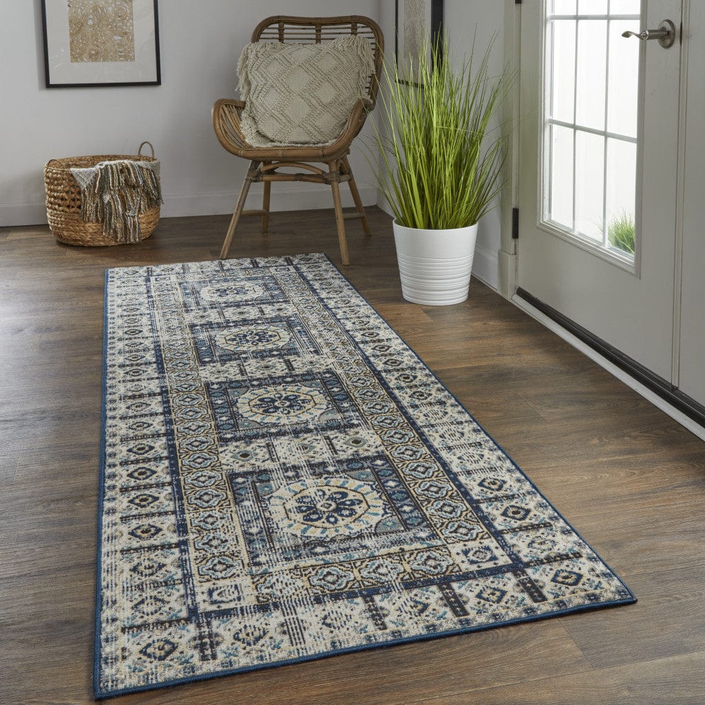 4' X 6' Ivory Tan And Blue Abstract Power Loom Distressed Stain Resistant Area Rug