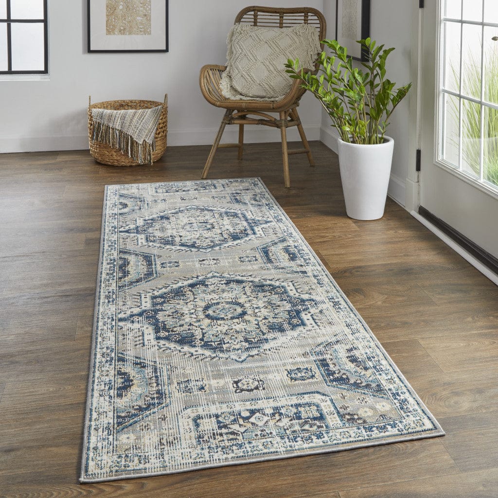 4' X 6' Blue And Ivory Abstract Power Loom Distressed Stain Resistant Area Rug