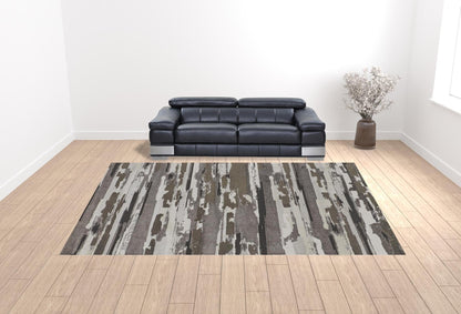 4' X 6' Brown And Ivory Abstract Power Loom Distressed Stain Resistant Area Rug