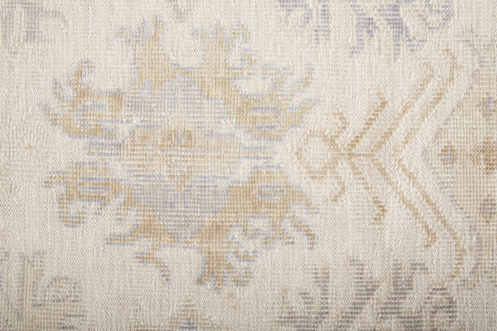 5' X 8' Ivory Tan And Blue Floral Hand Knotted Stain Resistant Area Rug