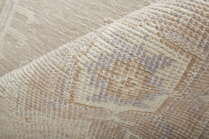 4' X 6' Tan And Brown Floral Hand Knotted Stain Resistant Area Rug