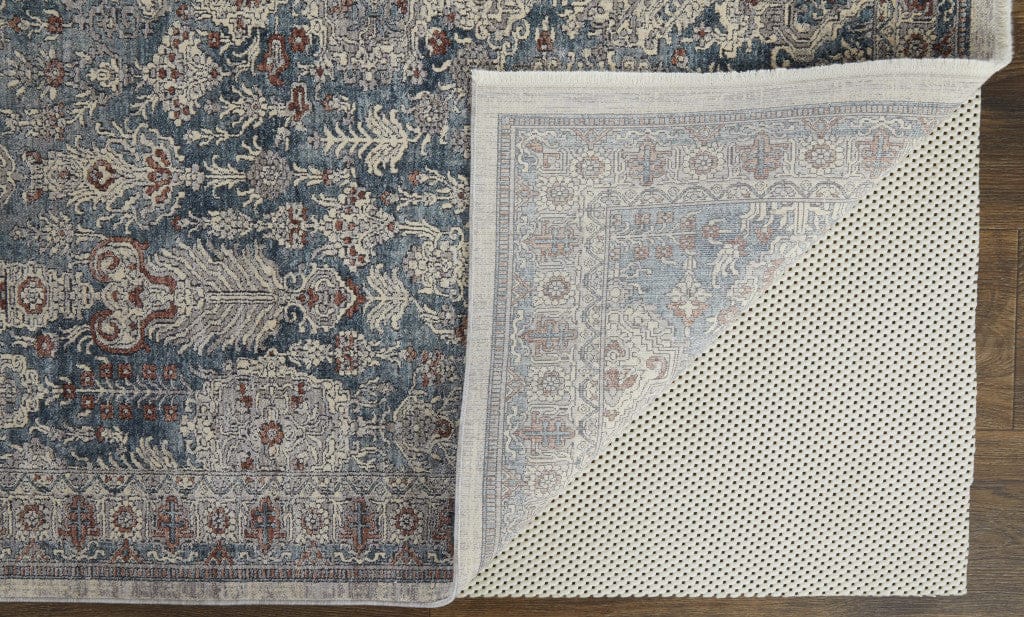 5' X 7' Blue And Ivory Floral Power Loom Stain Resistant Area Rug