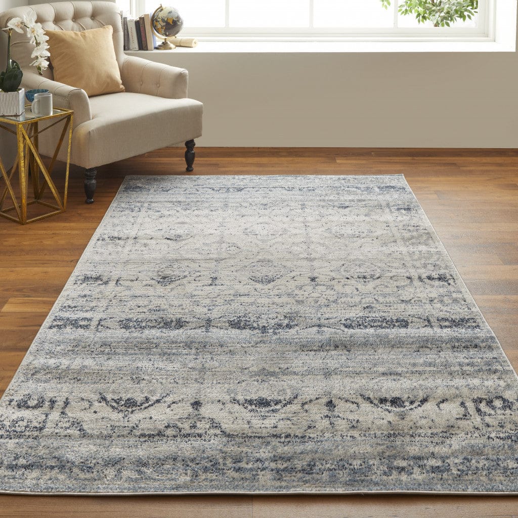 4' X 6' Blue And Ivory Power Loom Distressed Area Rug