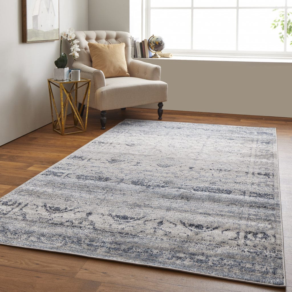 4' X 6' Blue And Ivory Power Loom Distressed Area Rug