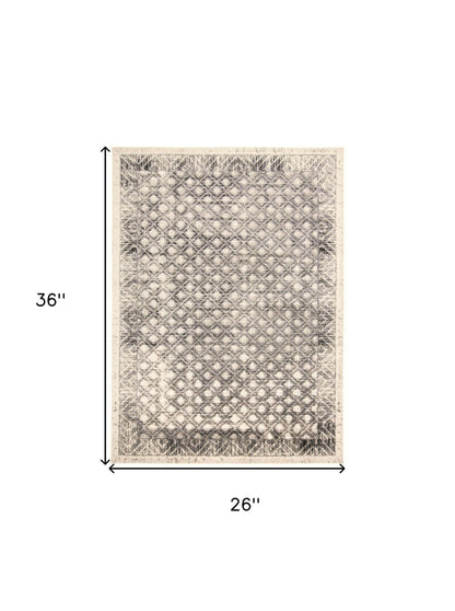 2' X 3' Ivory Black And Taupe Abstract Stain Resistant Area Rug