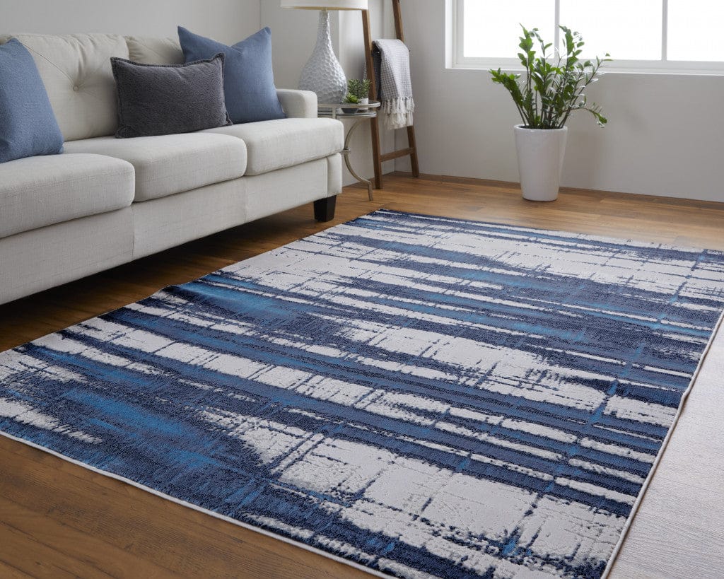 2' X 3' Ivory Blue And Gray Abstract Power Loom Distressed Area Rug